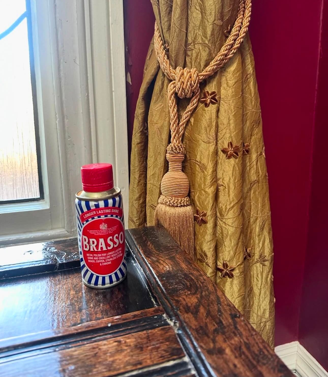 metal polish on a polished wooden windowsill