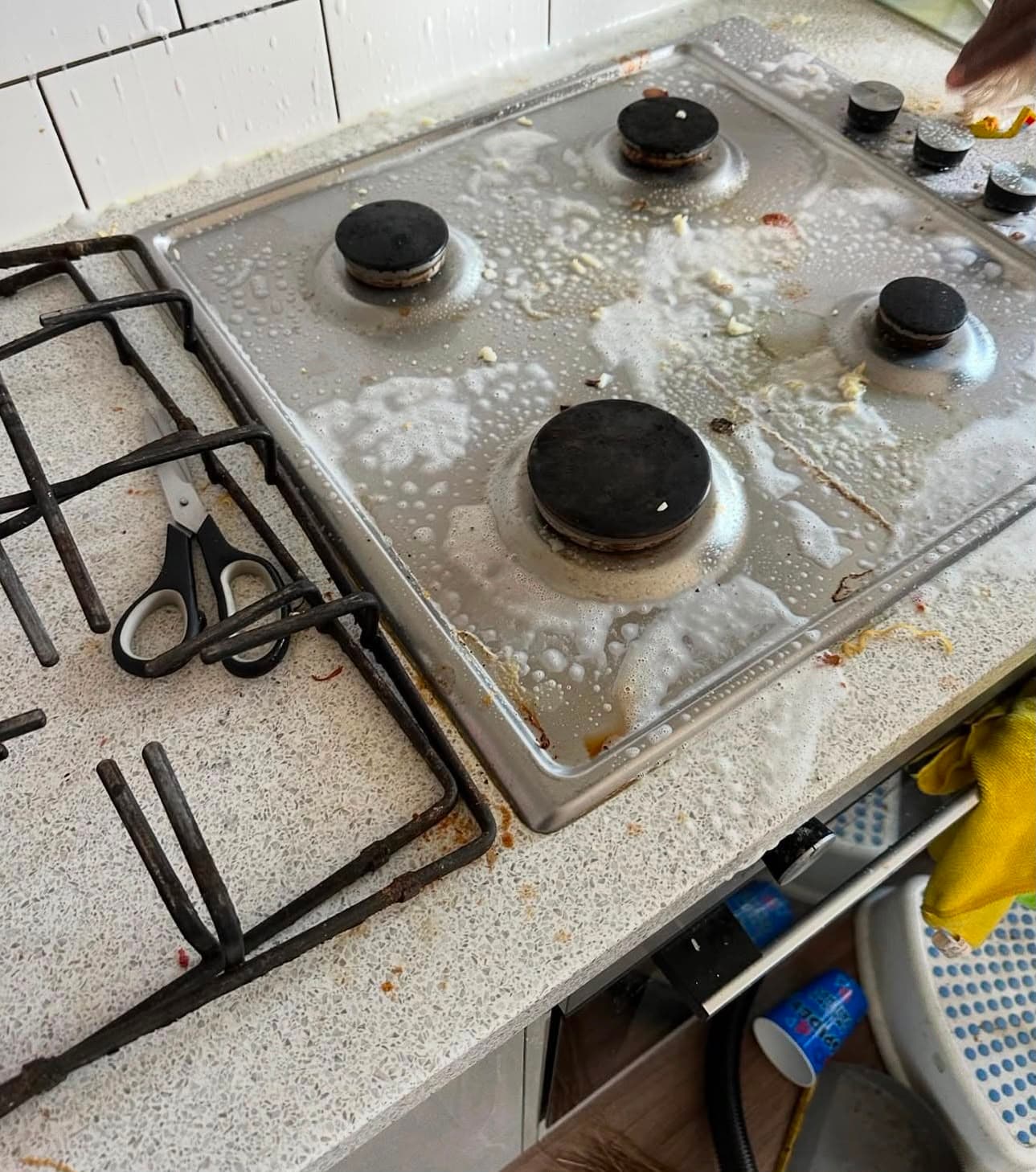 Before — a gas hob covered in burnt-on grease and food